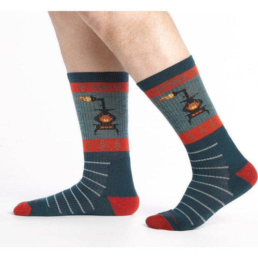 Side view of the Wide Open Men's Stoked Midweight Sock in Juniper showing the stove graphic and red toe on a white background.