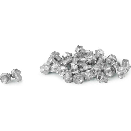 A pile of silver YakTrax 30 Cleats on a white background with two separate cleats to the left.