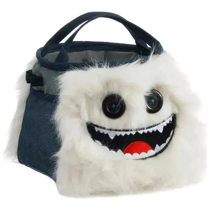 A front view of the 8BPlus Boulder Bucket - Herman chalk bag with a white furry face and dark blue straps against a white background.