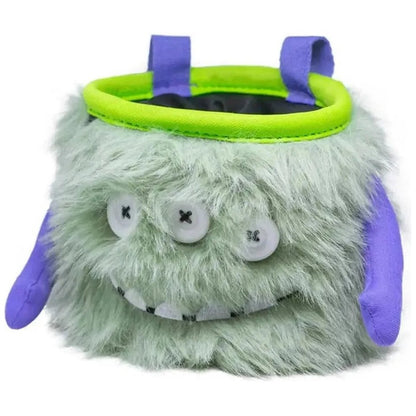 A front view of the 8BPlus Chalk Bag - Marty with a green top rim and purple straps, showing its fuzzy face and button eyes against a white background.