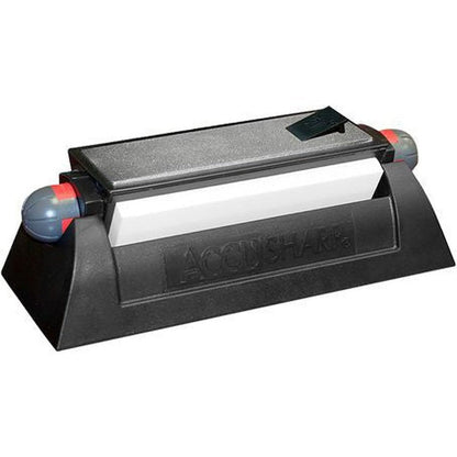 A top-down view of the AccuSharp Tri-Stone Sharpening System with a black base and gray stones against a white background.