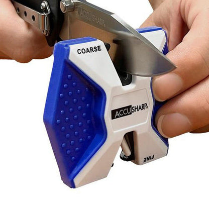 A hand holds a knife against the blue and white AccuSharp Two Step Sharpener with "COARSE" visible on the left side.