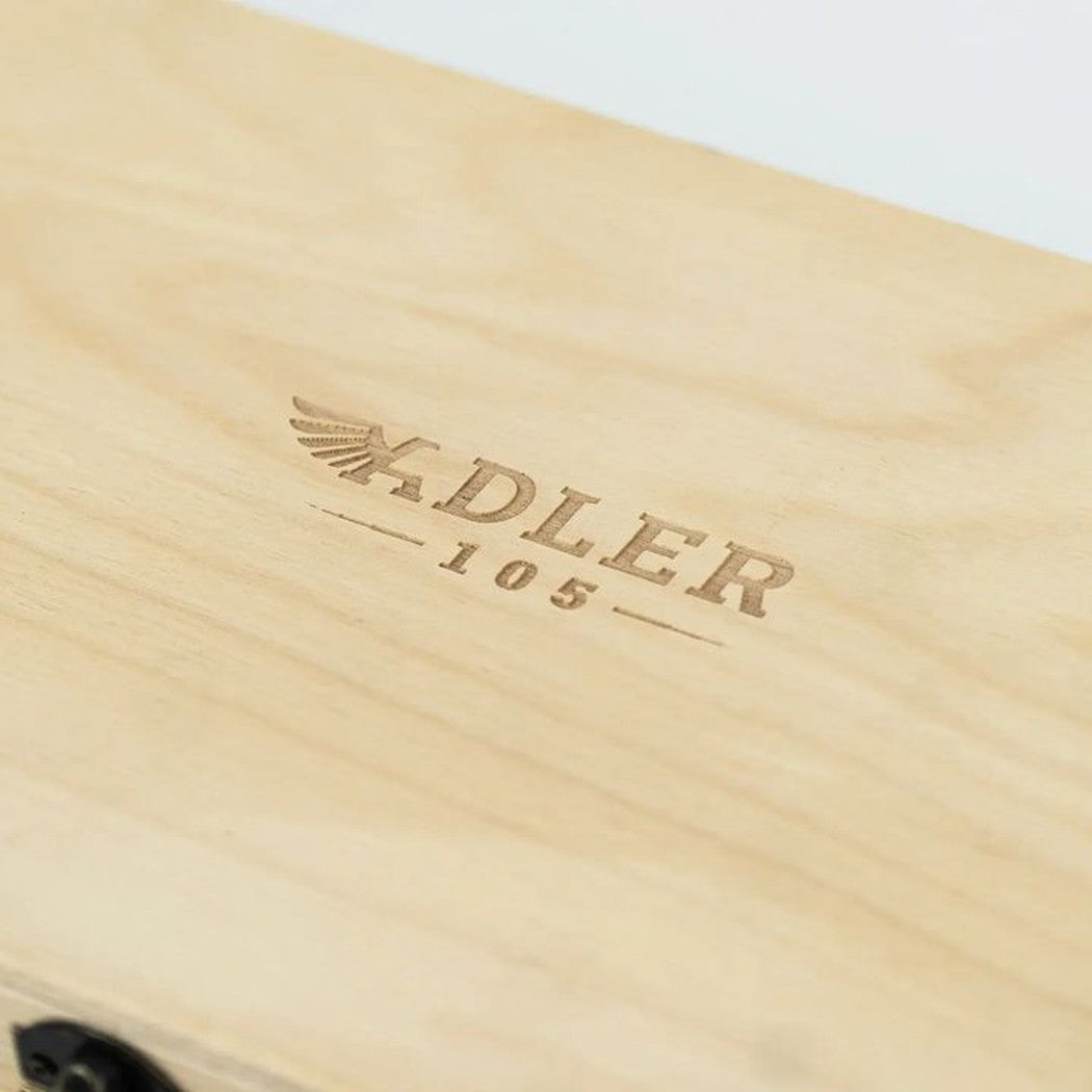 A close up of the Adler 105 wooden hatchet box with the brand name engraved on it.