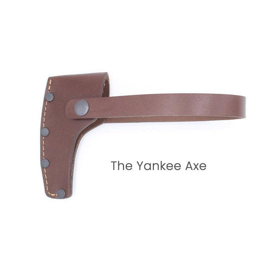 A brown leather sheath for The Yankee Axe with a strap and metal rivets, shown from a side angle against a white background.