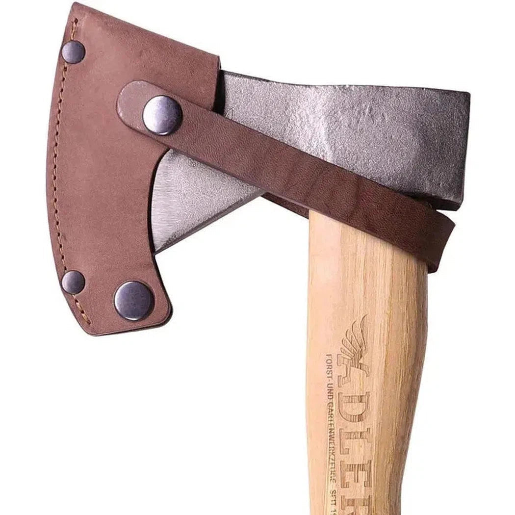 A close-up of the Adler The Rheinland Axe with a brown leather sheath and wooden handle, photographed against a white background.