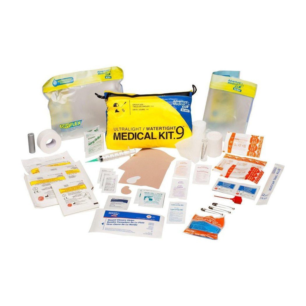 A top-down view of the Adventure Medical Kits Ultralight / Watertight .9 Medical Kit laid out on a white background.