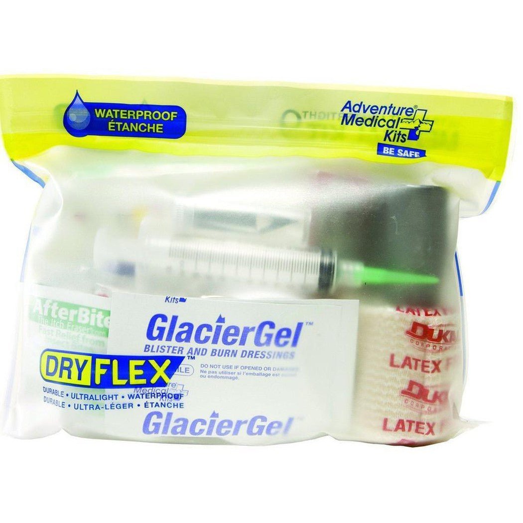 A yellow and clear waterproof package of Adventure Medical Kits Ultralight / Watertight .9 Medical Kit with GlacierGel and latex bandages visible inside.