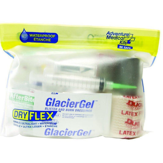 A yellow and clear waterproof package of Adventure Medical Kits Ultralight / Watertight .9 Medical Kit with GlacierGel and latex bandages visible inside.