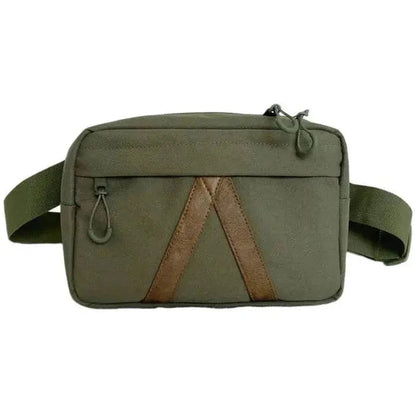 A front view of the Adventurist Backpack Co. Summit Sling Bag in Black with a brown accent stripe and adjustable strap against a white background.