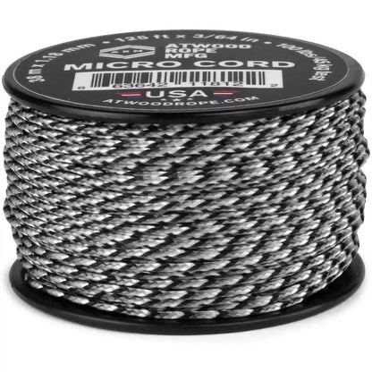 A spool of Atwood Rope Micro Cord in black is shown from a front angle with a white background.