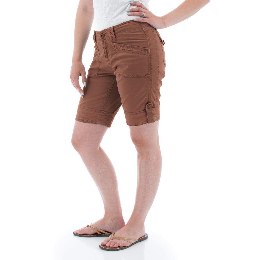 Side view of the Aventura Women's Arden V2 Short in Insigna Blue showing cargo pockets and a model wearing them against a white background.