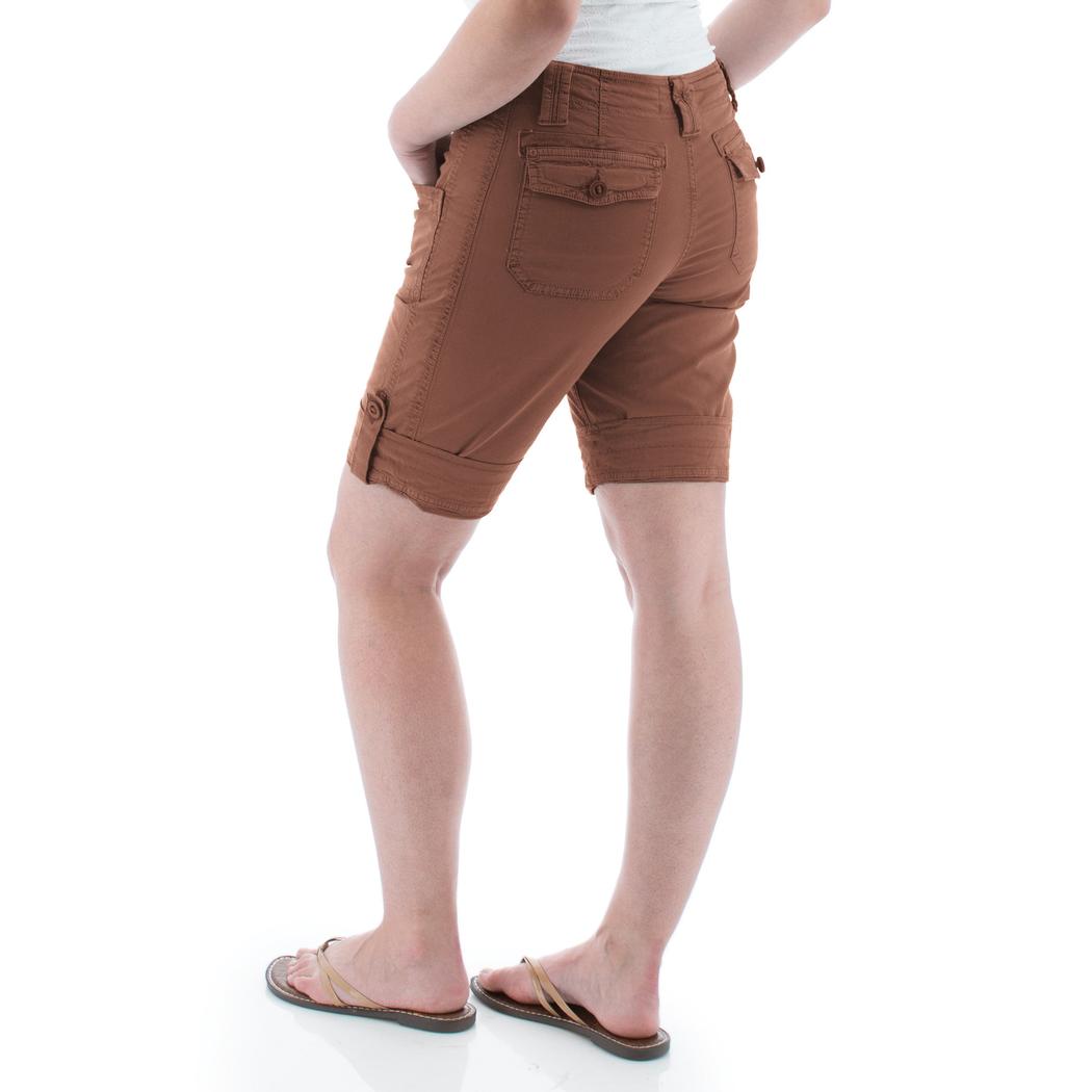 Back view of the Aventura Women's Arden V2 Short in Insigna Blue on a model wearing flip flops against a white background.