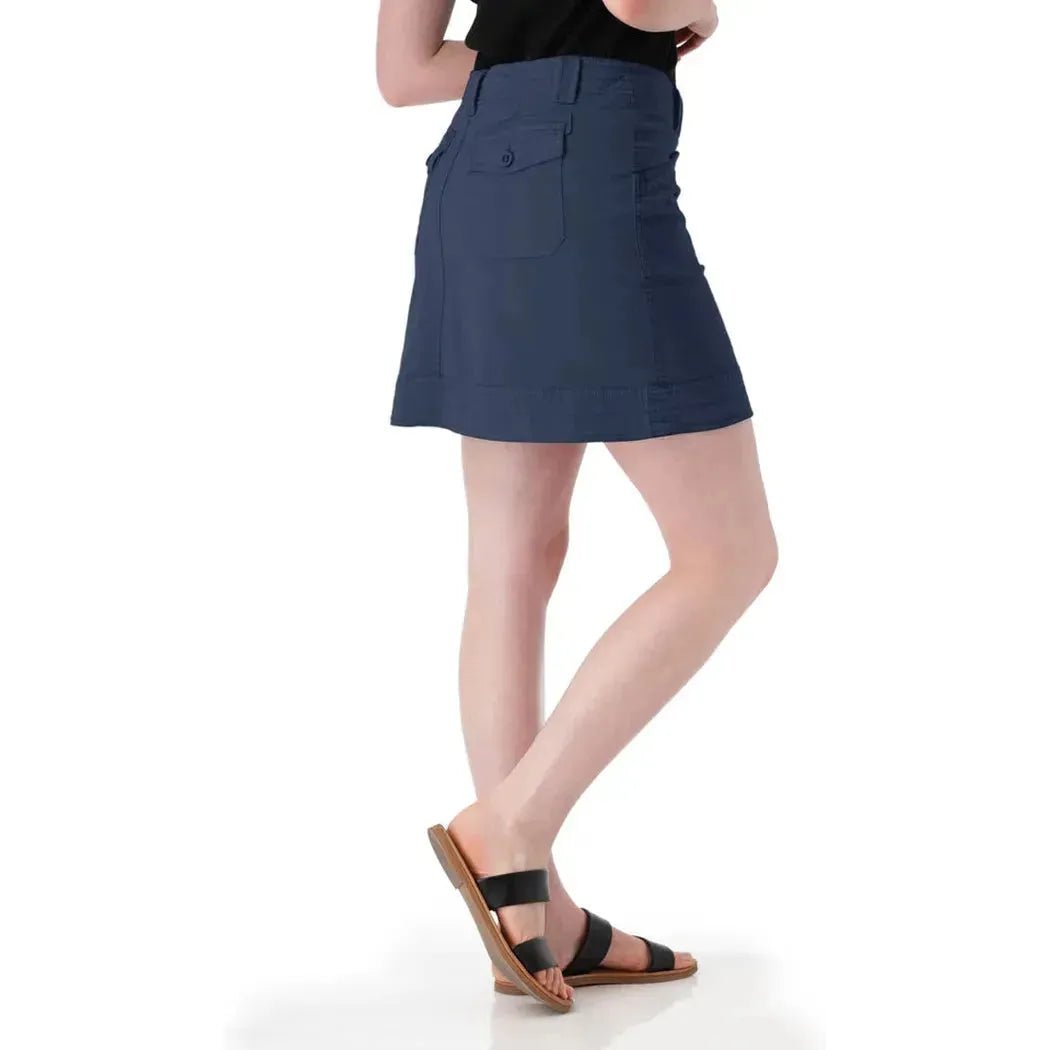 Side view of the Aventura Women's Arden V2 Skort in Granite Green showing the back pocket and model wearing it against a white background.