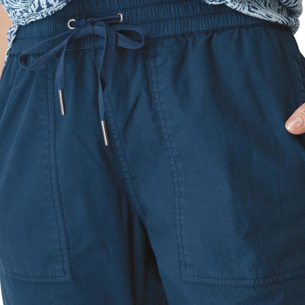 Side view of the Aventura Women's Ballard Ankle Pant in Botanical Green showing the drawstring waist and front pockets.