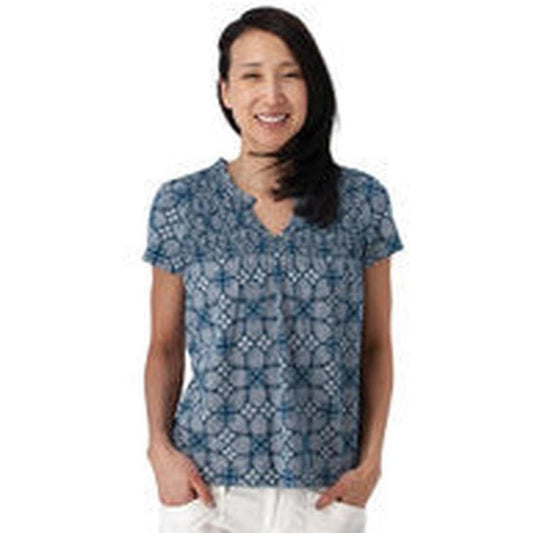 A woman wearing the Aventura Women's Cottage Top in Gibraltar Sea stands against a white background.