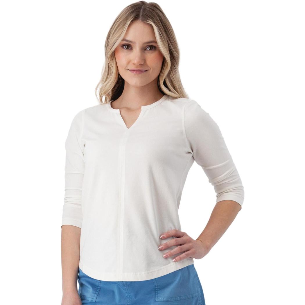 A woman wearing the Aventura Women's Juni 3/4 Sleeve white top stands against a plain white background.