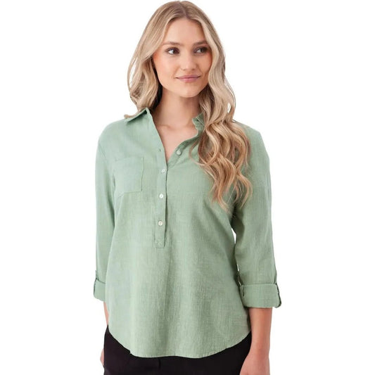 A woman wearing the Aventura Women's Laken Top in Granite Green stands against a white background.