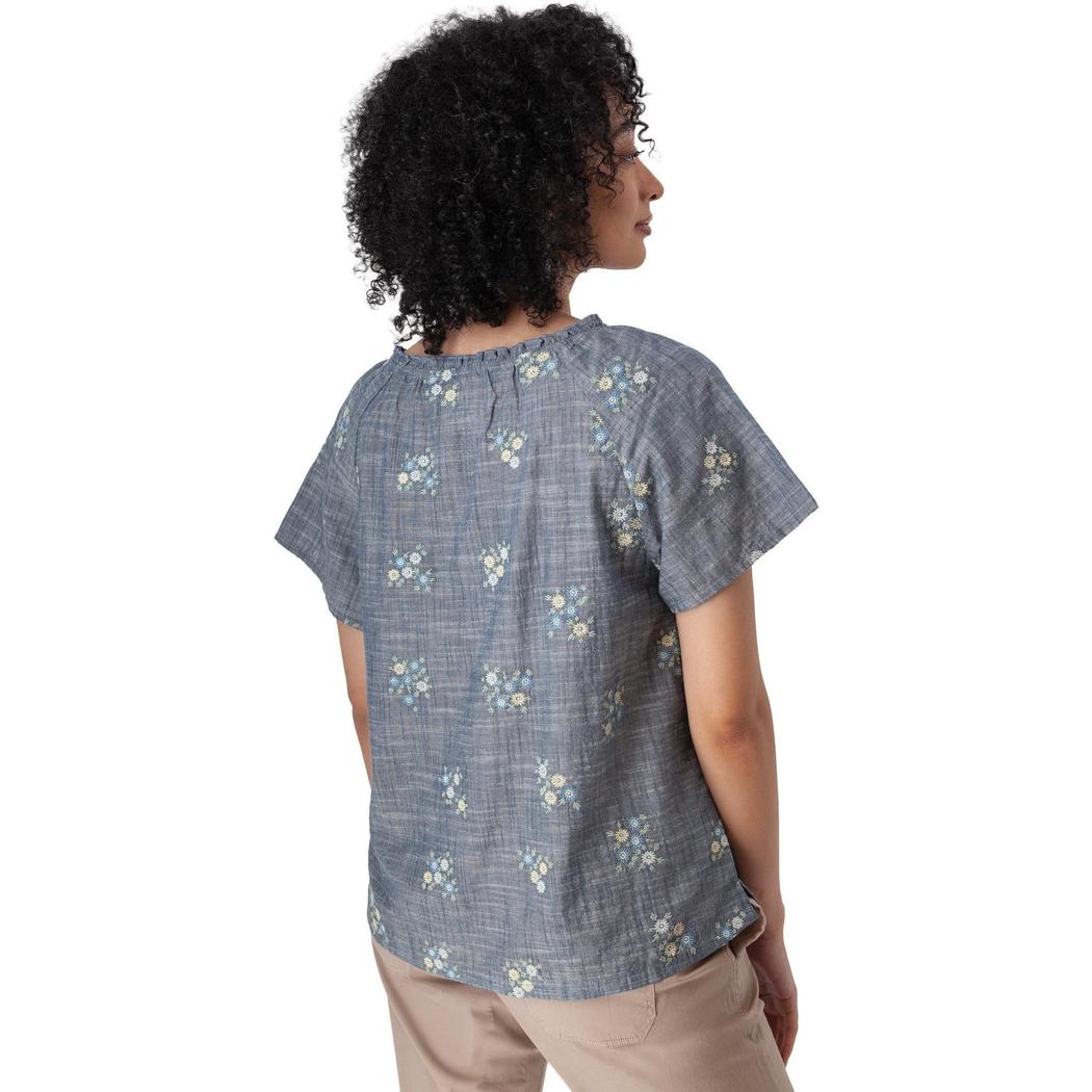 Back view of the Aventura Women's Mariposa Top in Gibraltar Sea showing the floral pattern and short sleeves on a model against a white background.