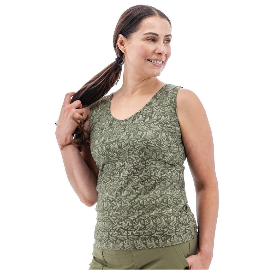 A woman wearing the Aventura Women's Soledad Top in Olive poses against a white background.