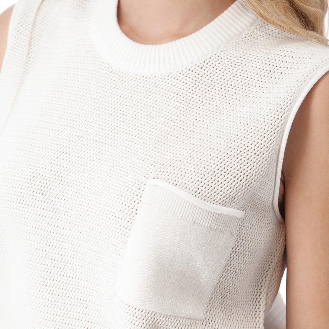 A close-up of the Aventura Women's Summertime Tank in White showing the front pocket and sleeveless design on a model.