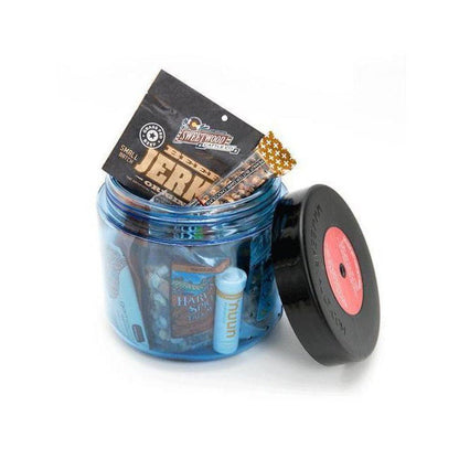 A blue Bear Vault BV450 - Jaunt food storage jar with its lid off, showing contents including a jerky package and lip balm, against a white background.