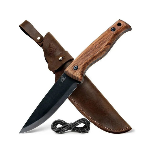 A natural wood handled Beavercraft BSH3 Bushcraft Knife with a charcoal blade rests in its brown leather sheath against a white background.