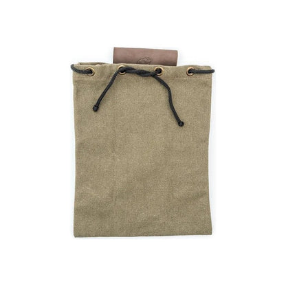 A natural, complete sentence describing the photo: Natural canvas Beavercraft Leather & Canvas Bushcraft Foraging Belt Bag Pouch for Camping with black drawstrings and a brown leather item peeking