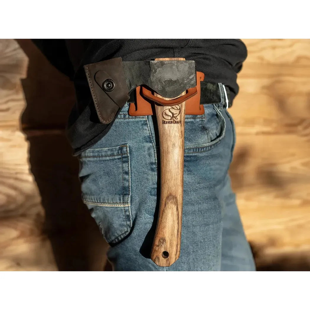 Side view of the Beavercraft Leather Tool Belt Hanger on a model wearing blue jeans against a wooden background.
