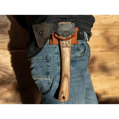 Side view of the Beavercraft Leather Tool Belt Hanger on a model wearing blue jeans against a wooden background.