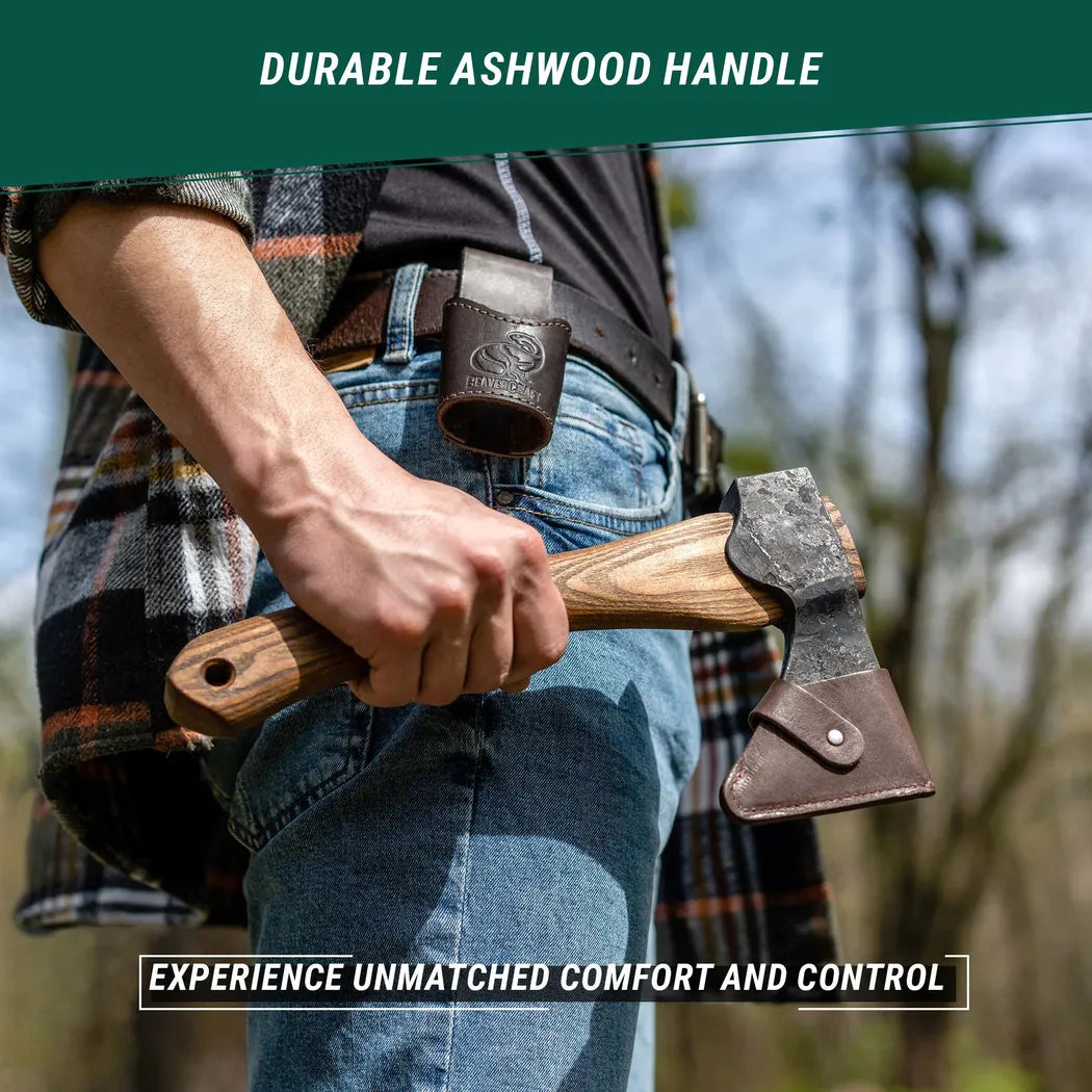 A person holding a Beavercraft Small Carving Axe with Leather Sheath in a forest background.