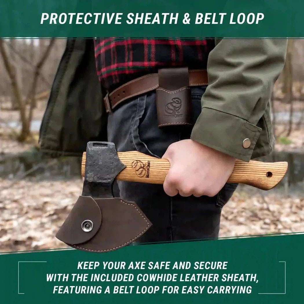 A person wearing a green jacket holds a Beavercraft Woodcraft Bushcraft Splitting Hatchet with a protective sheath and belt loop, against a wooded background.