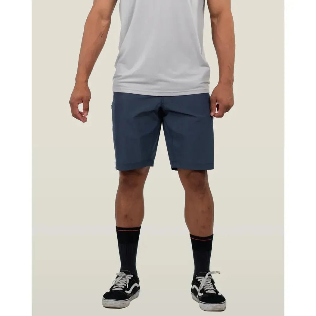 A front view of the Belong Designs Men's 10" Rocky Mountain Board Short in Desert Brown on a model against a plain background.