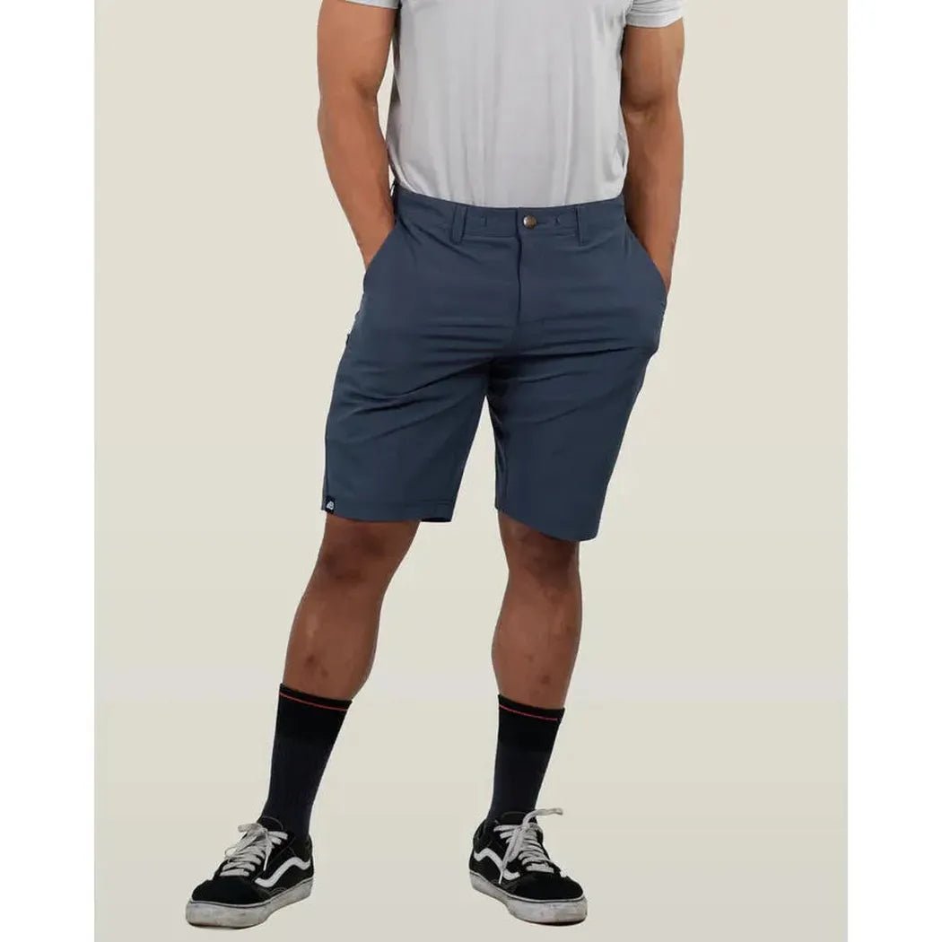 A front view of the Belong Designs Men's 10" Rocky Mountain Board Short in Desert Brown on a model wearing black socks and sneakers against a plain background.