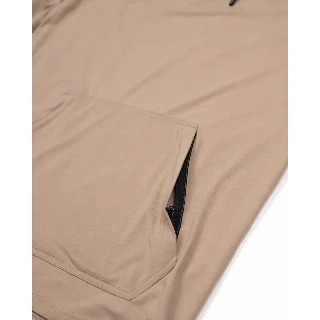 A close-up of the Belong Designs Men's Core Traverse Tek Hoodie in Dust showing the front pocket and zipper detail.