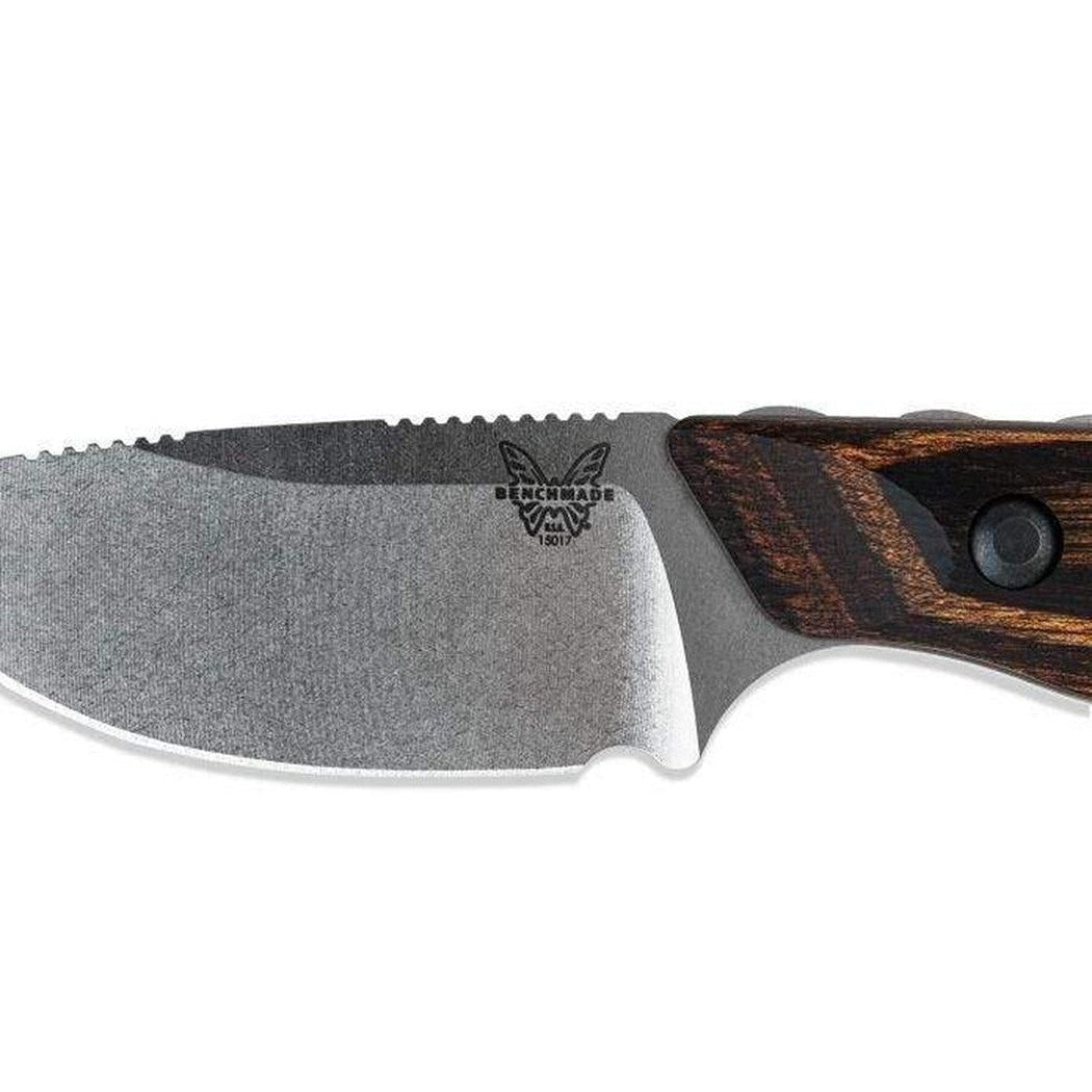 A side view of the Benchmade 15017 Hidden Canyon Hunter knife with a textured blade and a dark brown handle, photographed against a white background.