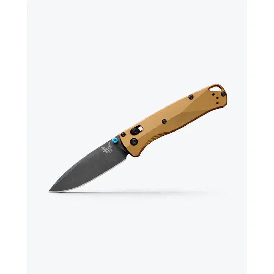 A side view of the Benchmade Bugout knife with a charcoal/ graphite blade and tan handle against a white background.
