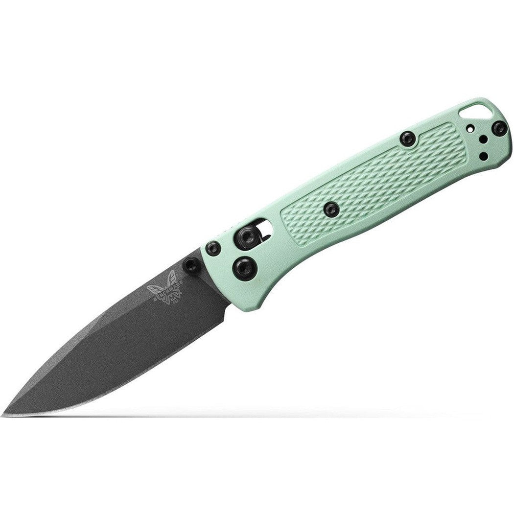 A side view of the Benchmade Mini Bugout knife with a mint green handle and a charcoal-colored blade against a white background.