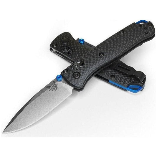 A side view of the Benchmade Mini Bugout knife with a charcoal/ graphite handle and blue accents against a white background.