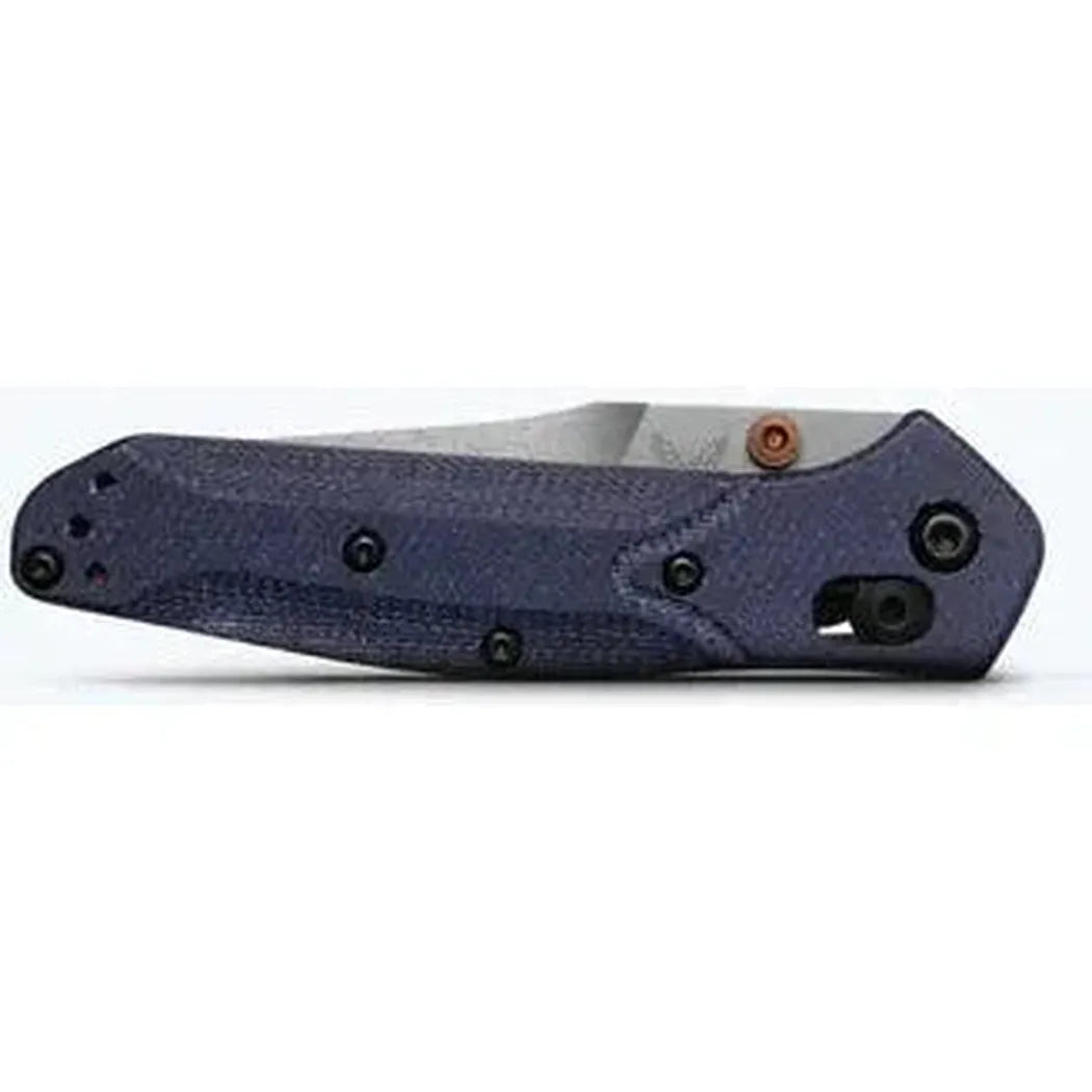 Side view of the Benchmade Mini Osborne knife with a dark blue handle and visible pocket clip against a white background.