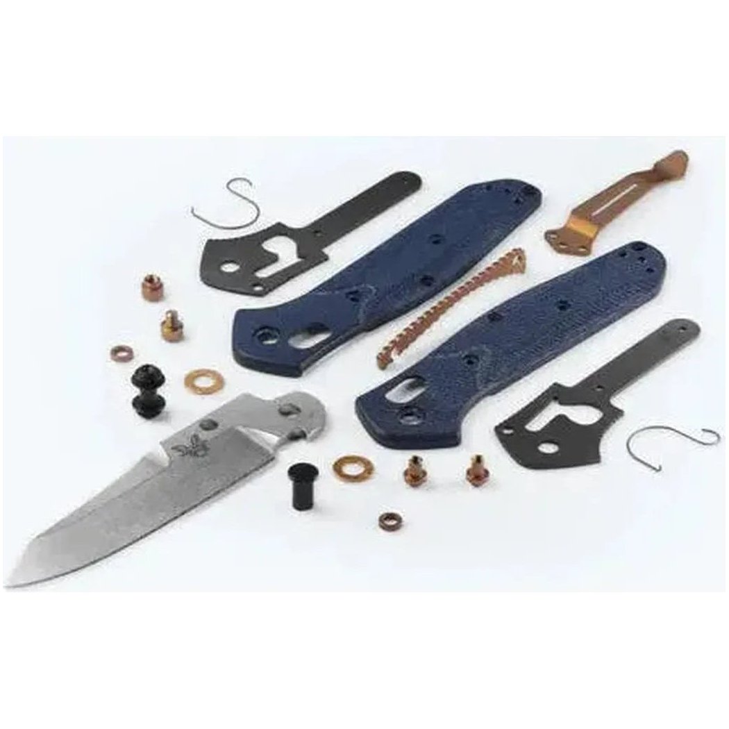 A disassembled Benchmade Mini Osborne knife with blue handles and various components laid out on a white background.