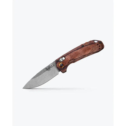 A side view of the Benchmade North Fork with Maple Stabilized Wood handle and a textured blade against a white background.