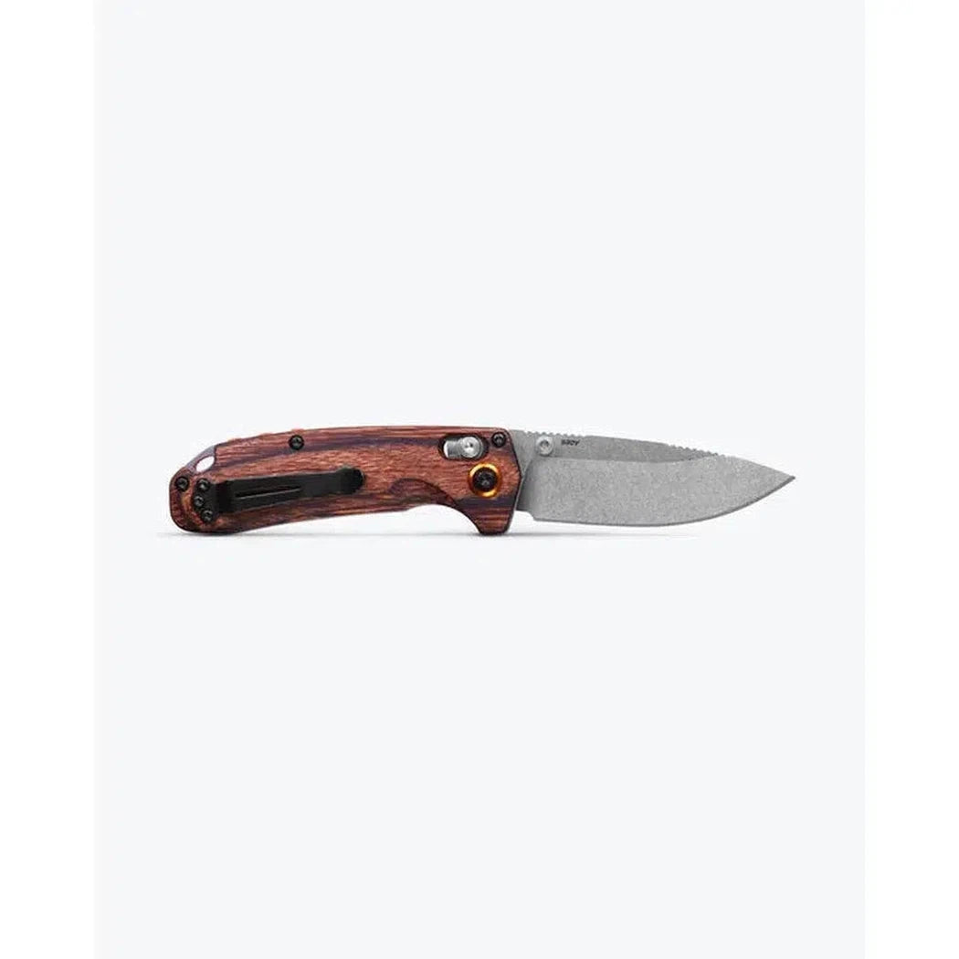 A side view of the Benchmade North Fork with Maple Stabilized Wood handle and a textured blade against a plain white background.