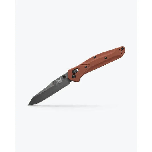 A side view of the Benchmade Osborne knife with a red handle and charcoal blade against a white background.