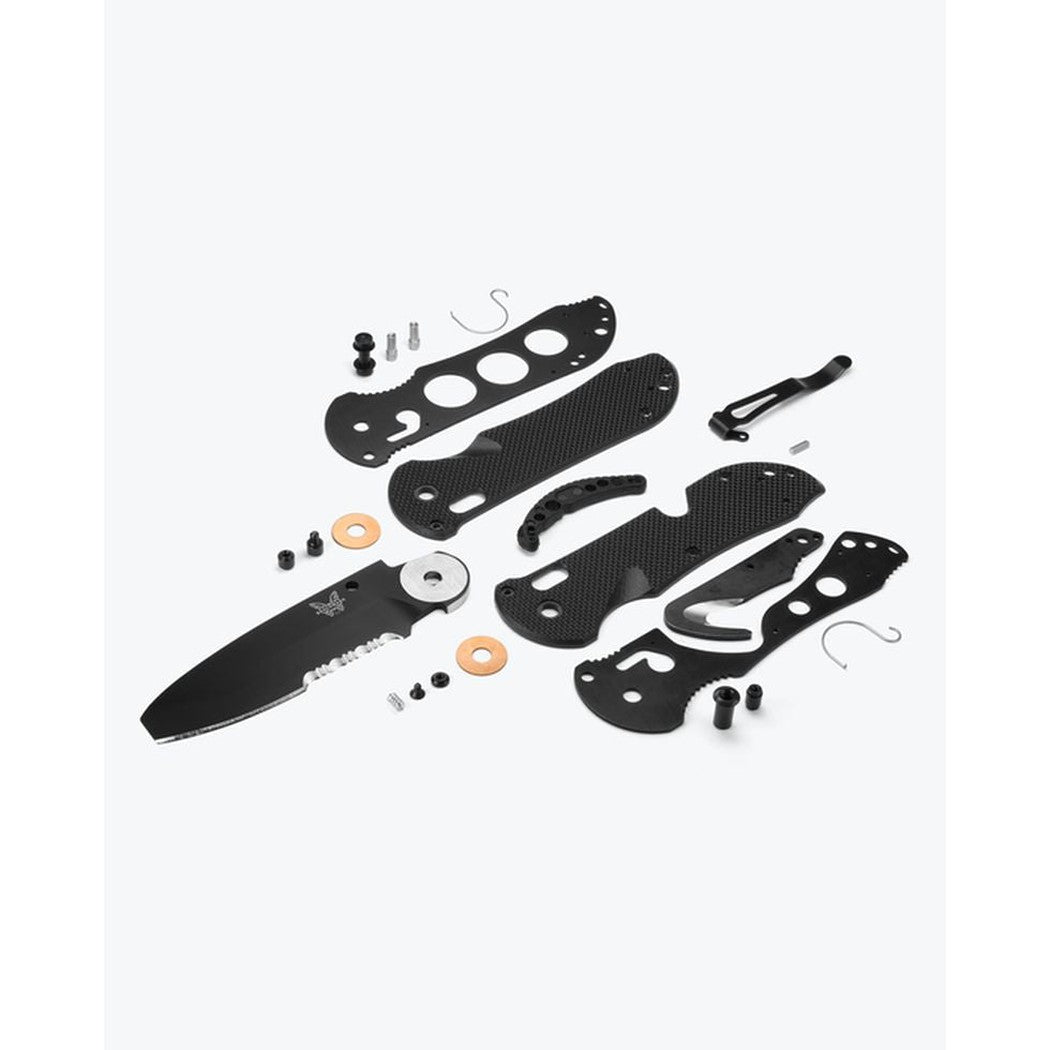 A top-down view of the Benchmade Triage Family knife kit laid out on a white background.