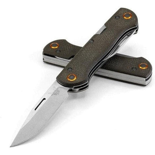 A side view of the Benchmade Weekender knife with a charcoal/ graphite handle and stainless steel blade against a white background.