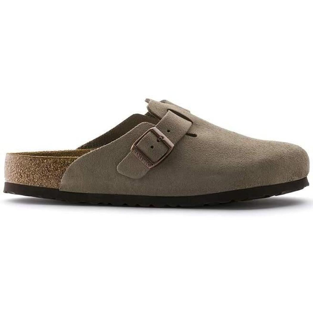 Side view of the Birkenstock Boston Soft Footbed - Suede Leather in Taupe showing the buckle and cork footbed against a white background.