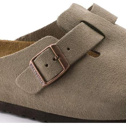 Close-up of the Birkenstock Boston Soft Footbed - Suede Leather in Taupe showing the buckle and suede upper against a white background.