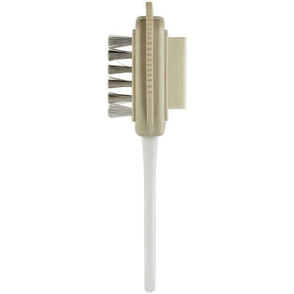 A front view of the Birkenstock Deluxe Shoe Care Kit with a white handle and metal bristles against a white background.