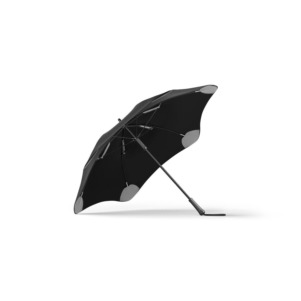 Side view of the Blunt Classic Black umbrella with gray accents on the edges, displayed against a white background.