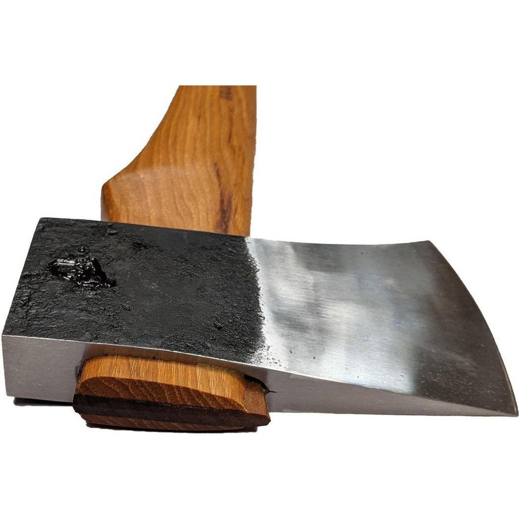 A close-up of the Brant & Cochran Allagash Cruiser Maine Wedge Camp Axe with a wooden handle and a metal head showing a charred spot, photographed against a white background.
